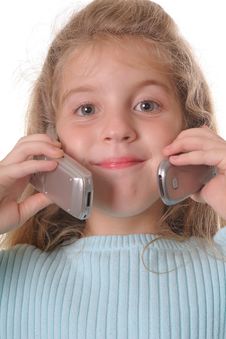 Young Girl Talking On Two Cellphones Royalty Free Stock Photos Young Girl Talking On Two Cellphones Royalty Free Stock Photos
