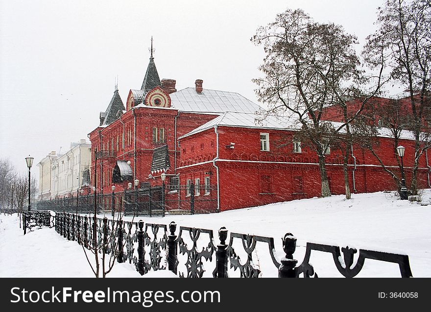 Snowfall in old city, winter