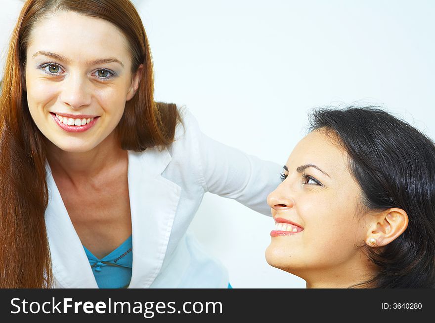 Portrait of two young woman on white back. Portrait of two young woman on white back