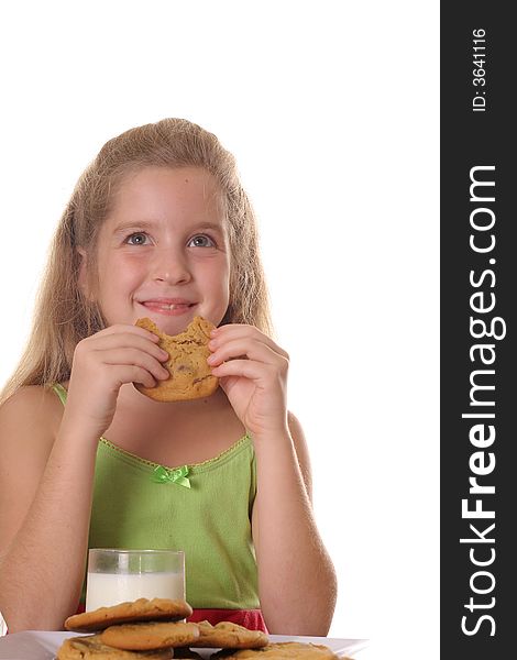 Photo of a happy little girl with a cookie vertical. Photo of a happy little girl with a cookie vertical