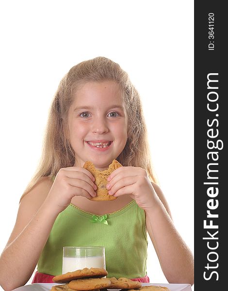 Young child eating chocolate chip cookie