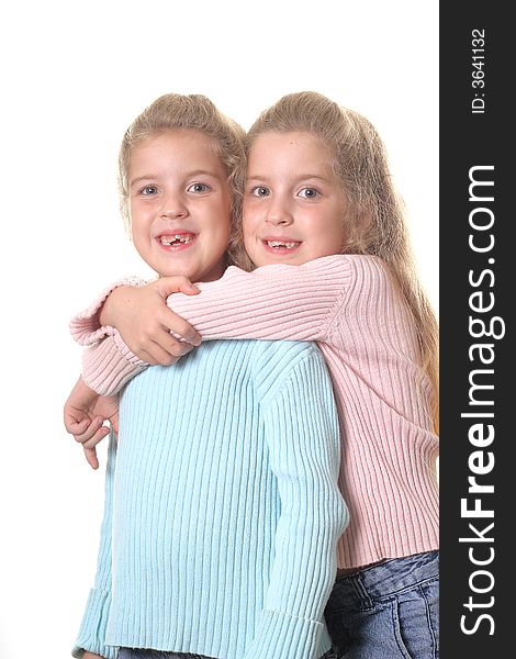 Shot of identical twin sisters on white