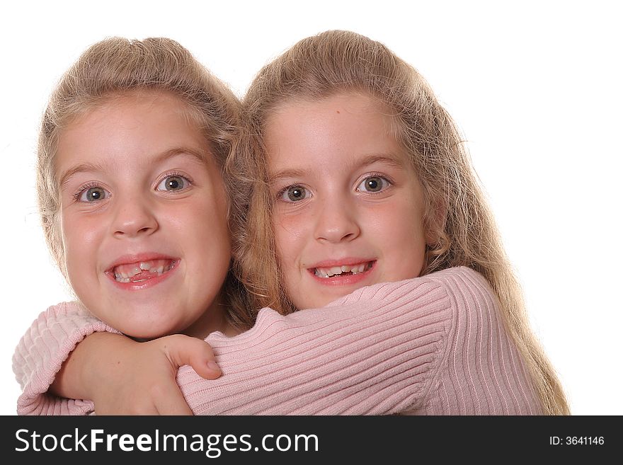 Happy Sisters Hug On White