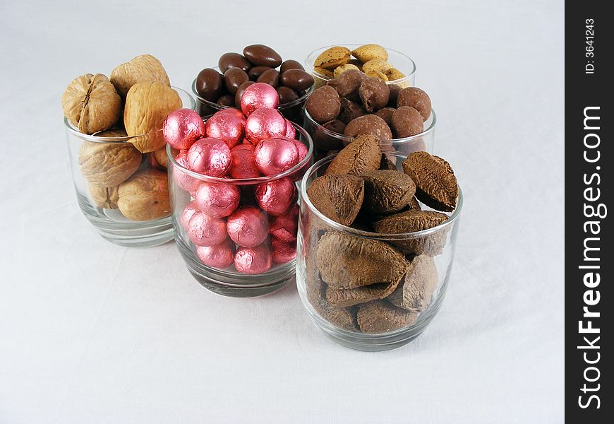 Candy and nuts displayed against a white background. Candy and nuts displayed against a white background.