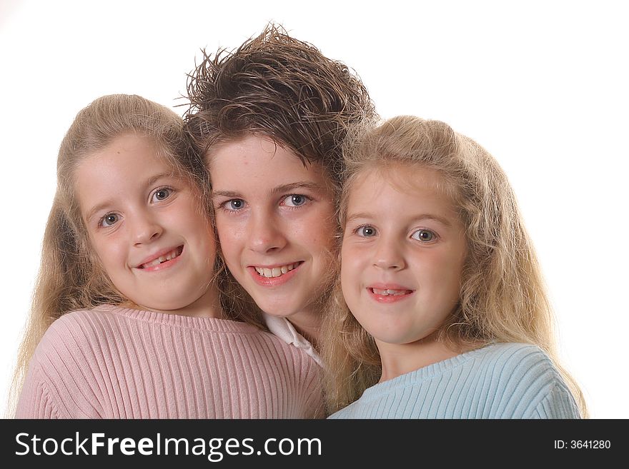 Photo of Three siblings on white
