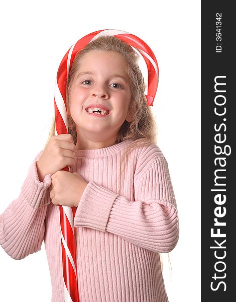 Little girl with candy cane vertical