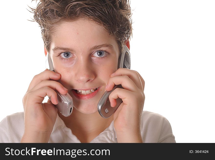Young boy talking on two cell phones
