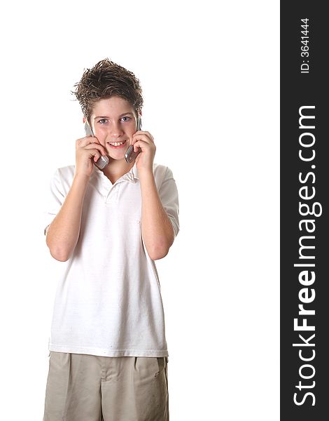 Shot of a young boy talking on two cell phones full shot