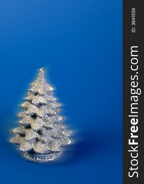 Beautiful single christmas tree on blue background. Beautiful single christmas tree on blue background
