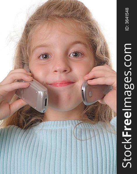 Shot of a young girl talking on two cellphones