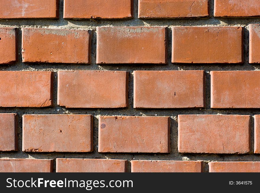 Reddish-brownish colored brick wall texture