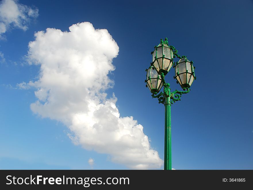 A street lamp against sky.