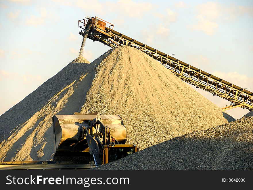 Gravel Operation with heavy equipment and conveyor moving gravel. Gravel Operation with heavy equipment and conveyor moving gravel
