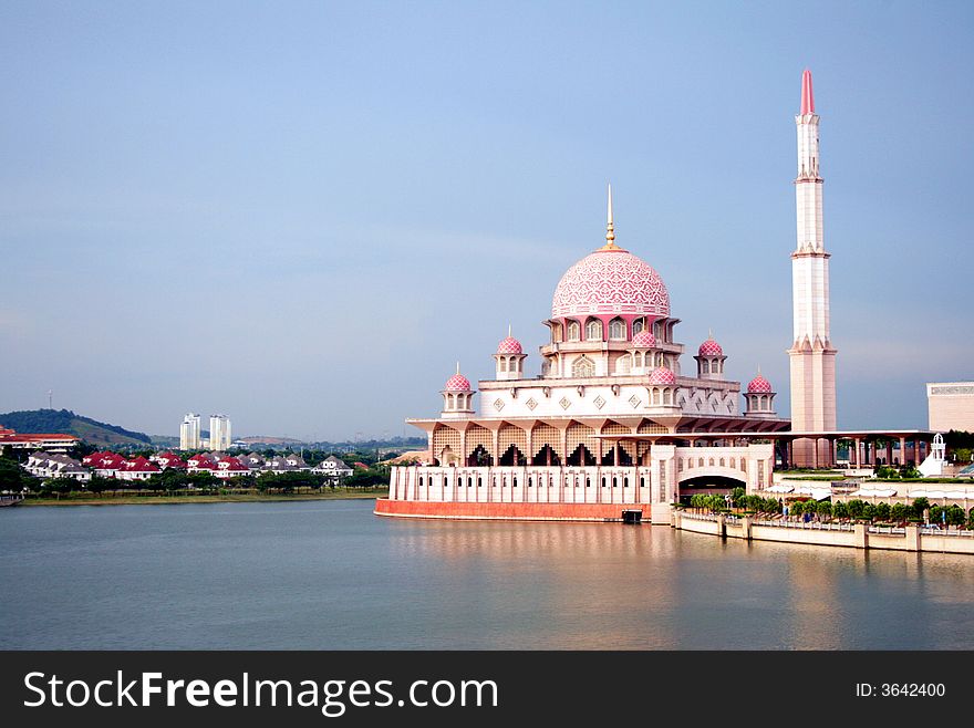 Red Floating mosque on lake depicting religious architecture