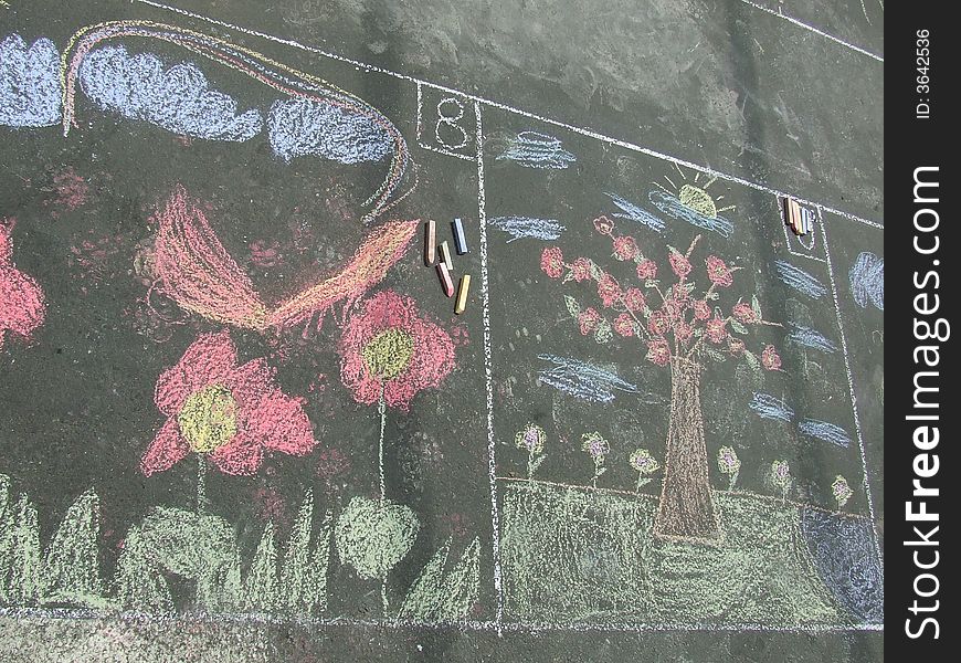 Beautiful drawing made with chalk by little child. Beautiful drawing made with chalk by little child
