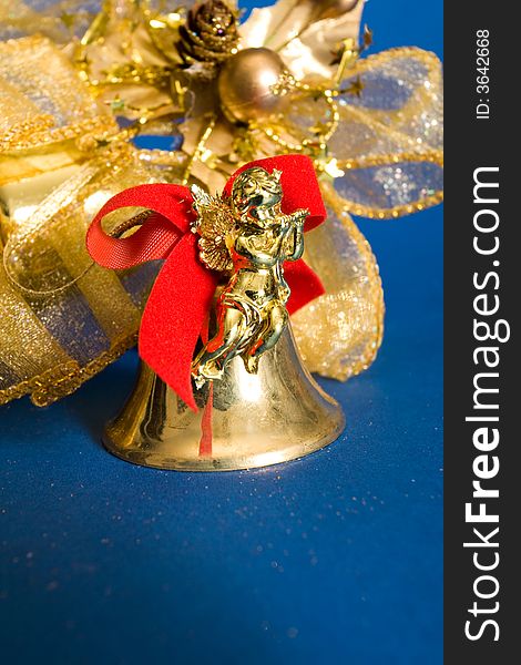 Golden christmas bell on blue background. Golden christmas bell on blue background