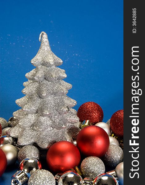 Silver sparkle christmas tree on blue. Silver sparkle christmas tree on blue