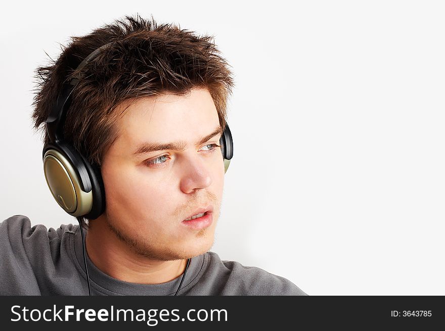 Young Man listening music in headphones