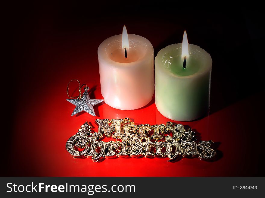 Christmas, star and couple candle all in the dark background for Christmas and New year decoration. Christmas, star and couple candle all in the dark background for Christmas and New year decoration