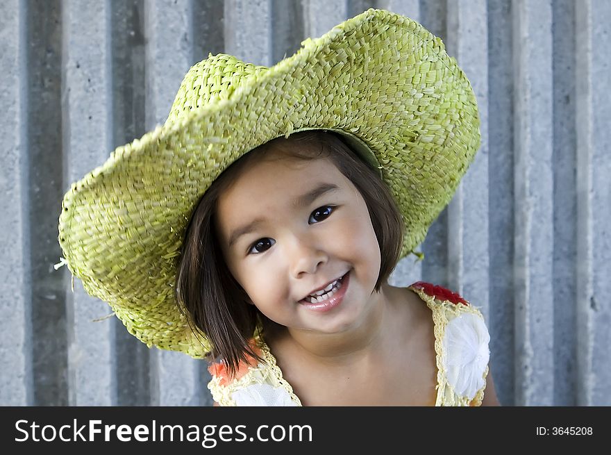 Little girl wearing green hat. Little girl wearing green hat