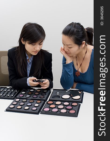 A girl was demonstrating a makeup product sales. A girl was demonstrating a makeup product sales