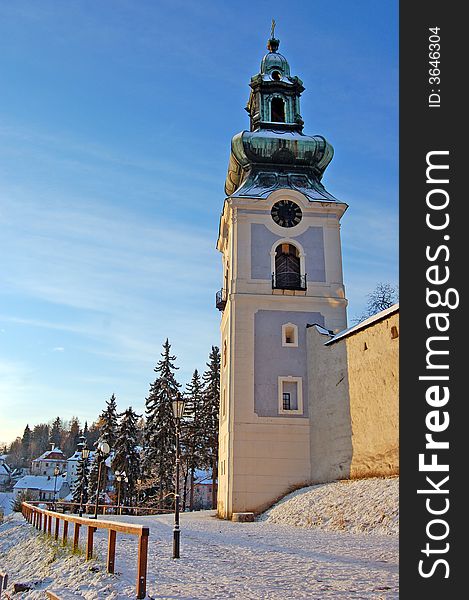 A church in a winter landscape in Banska Stiavnica - a city which is on the UNESCO list of national heritages