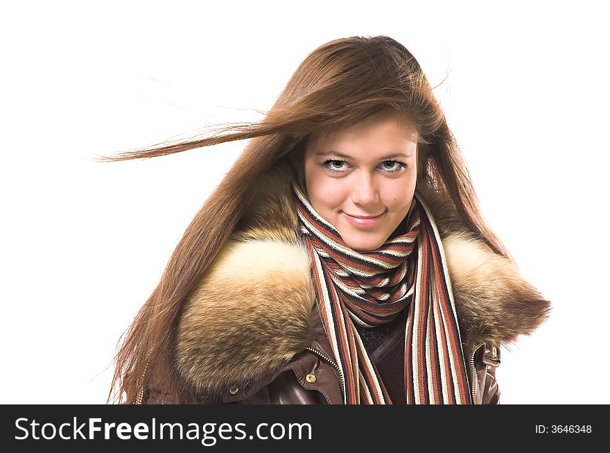 A smiling beautiful girl in winter clothes