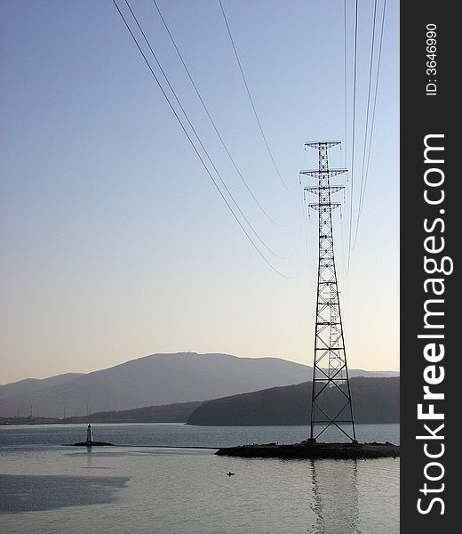 Lighthouse and power transmission tower