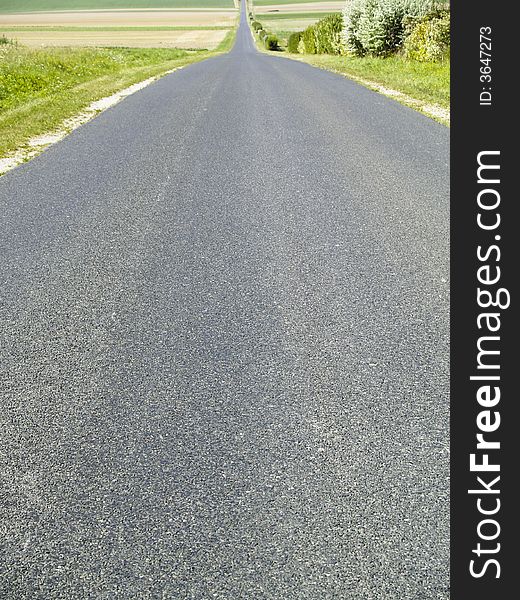 Small empty straight  route. Summer sunny day in france. Small empty straight  route. Summer sunny day in france.