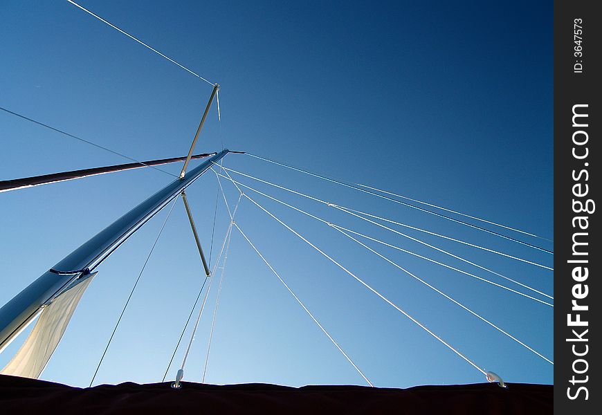 A view looking up the main mast of the sailboat. A view looking up the main mast of the sailboat.