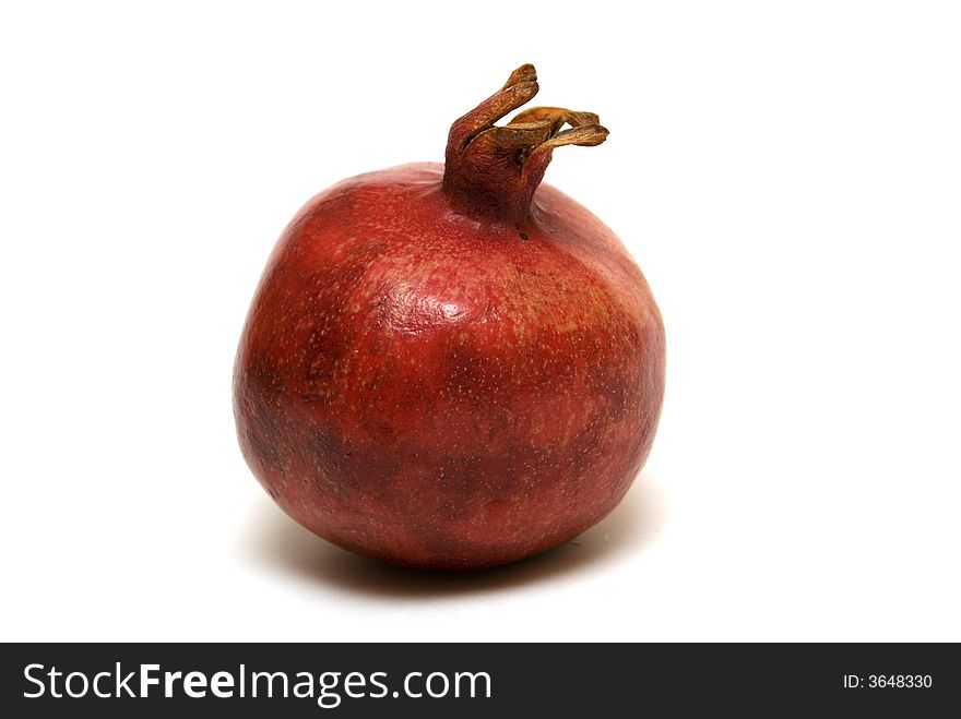 Juicy pomegranate on the white background