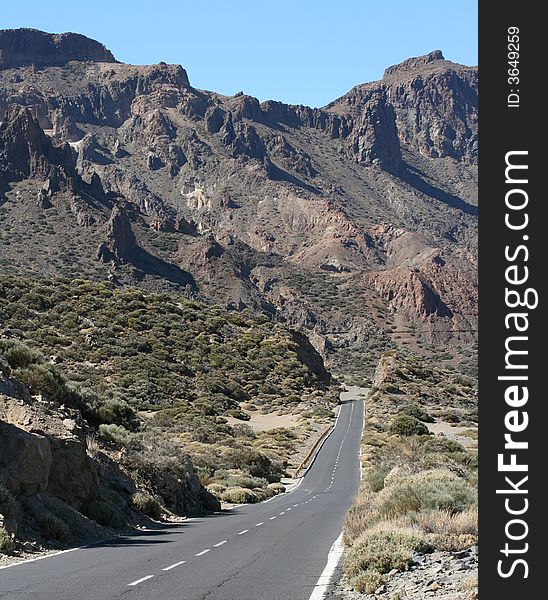 The mountain road and the blue sky as a background.