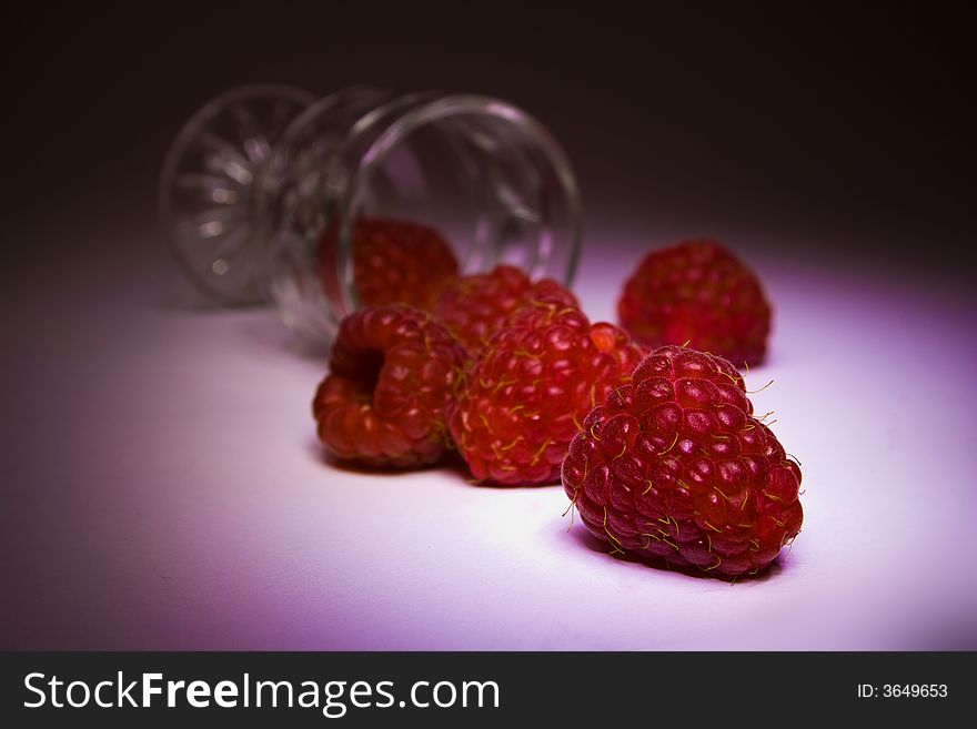 Cultivated heaped raspberries from glass. Cultivated heaped raspberries from glass