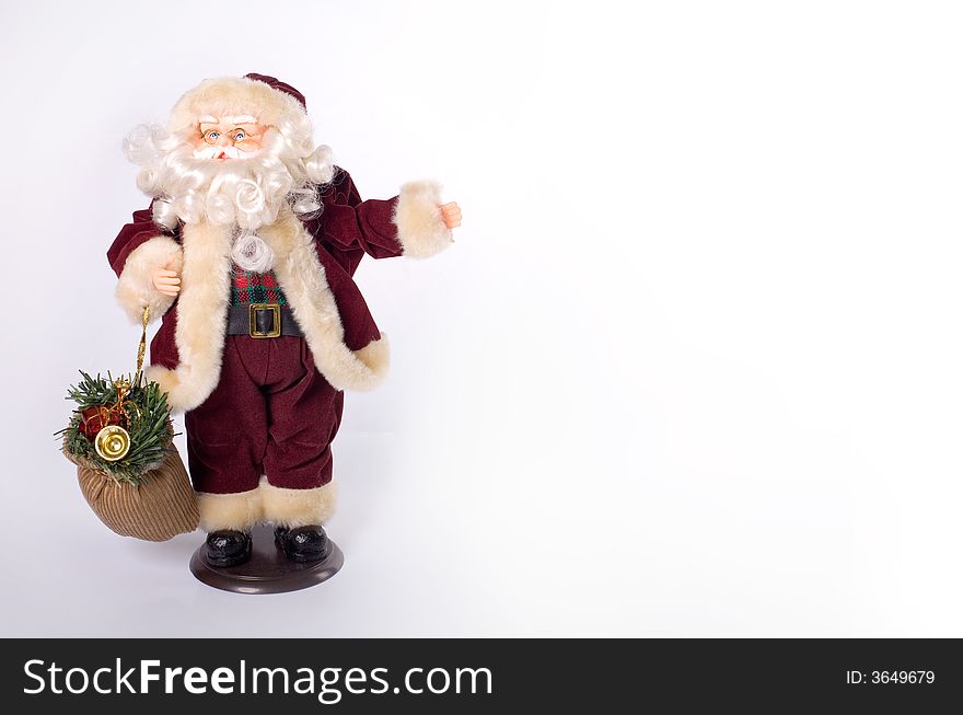 Toy Santa showing empty space -  place for your advertisment