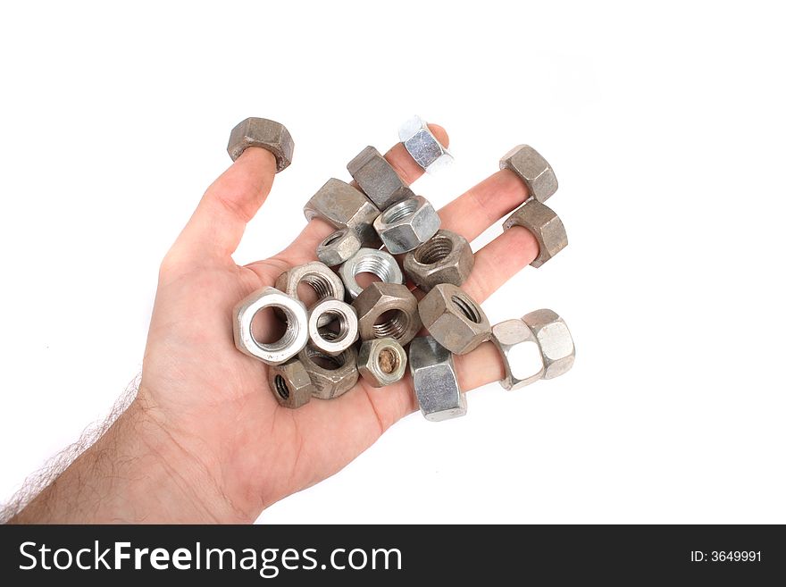 Steel nuts on the young hand on the white background. Steel nuts on the young hand on the white background