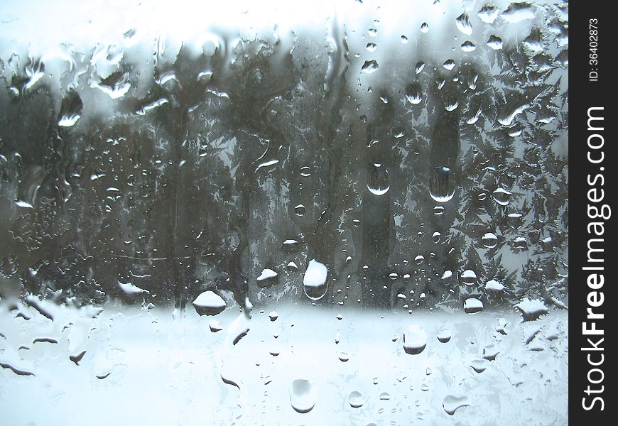 This is frosty pattern on glass winter window. This is frosty pattern on glass winter window