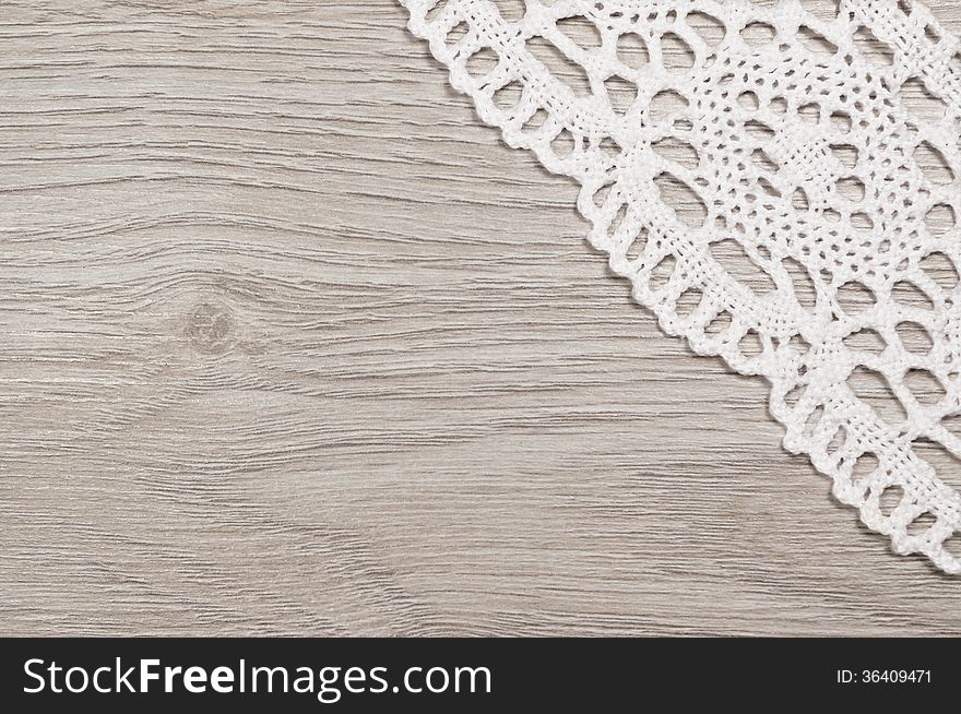 White Lace On A Wooden Background