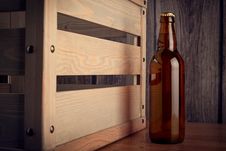 A Bottle Of Beer Next To A Wooden Box Stock Photos
