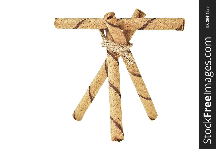 Triangular wafer stick and beam binding by hemp rope on white background. Triangular wafer stick and beam binding by hemp rope on white background