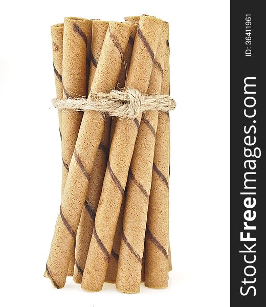 Binding of wafer stick group by hemp rope on white background. Binding of wafer stick group by hemp rope on white background