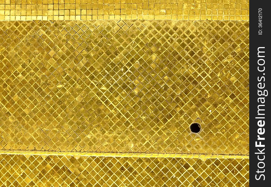 Surface of golden tile decoration at stupa base. grand palace, Phrakaew temple, Bangkok, Thailand. Surface of golden tile decoration at stupa base. grand palace, Phrakaew temple, Bangkok, Thailand