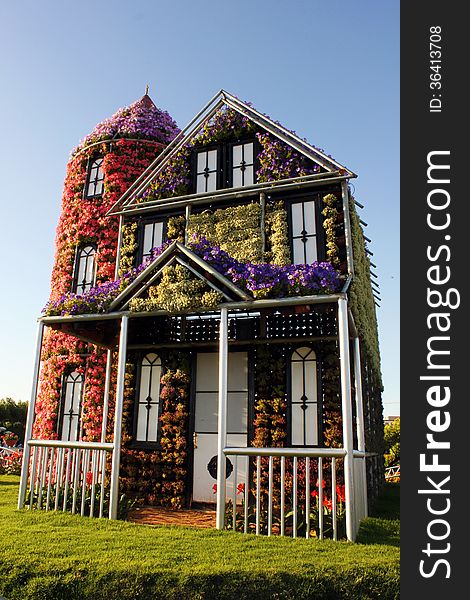 House covered with flowers on display at Miracle garden in Dubai. House covered with flowers on display at Miracle garden in Dubai