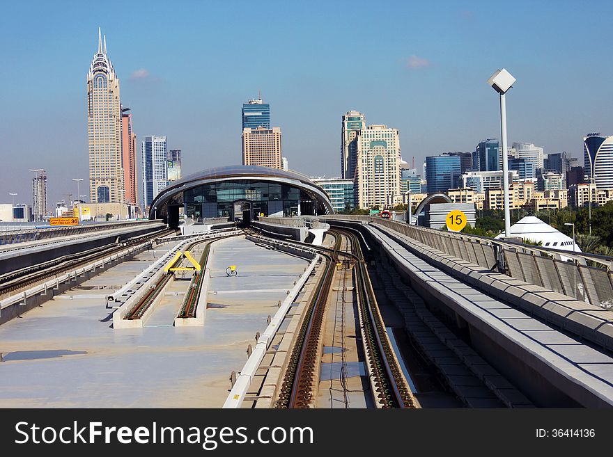 Metro approaching Metro station in Dubai, UAE. Metro approaching Metro station in Dubai, UAE