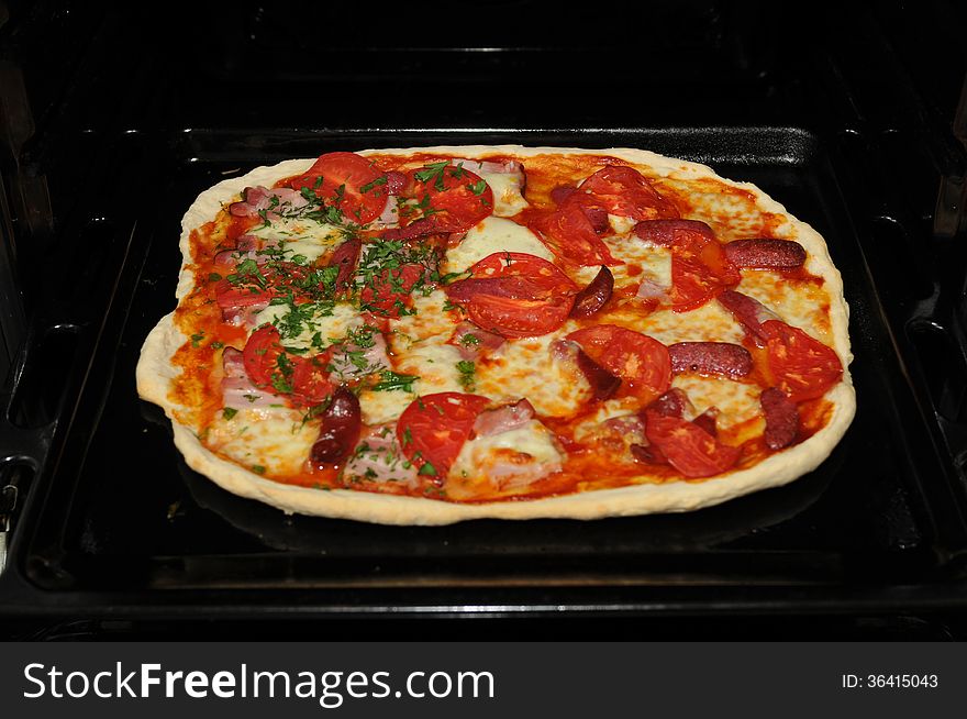 Ready Home Pizza In Open Black Oven