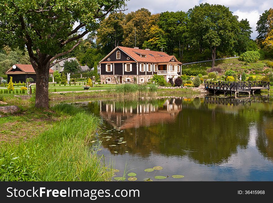 Big Family House in Front of the Lake in the Forest