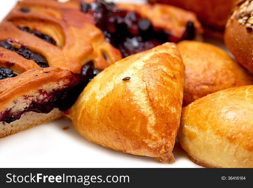 Assorted pastries and pies with filling on isolated background, baking. Assorted pastries and pies with filling on isolated background, baking