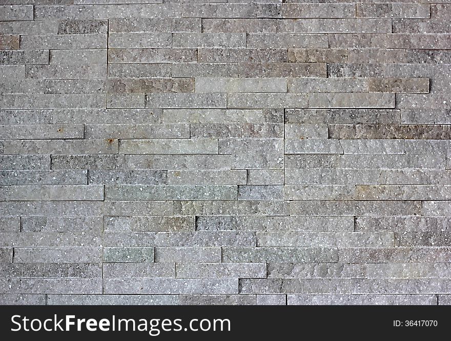 Wall built of granite blocks of white color