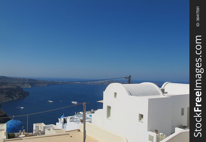 Caldera View in Santorini, Greece, Europe. You can see amazing white local houses and the amazing blue of the sea.