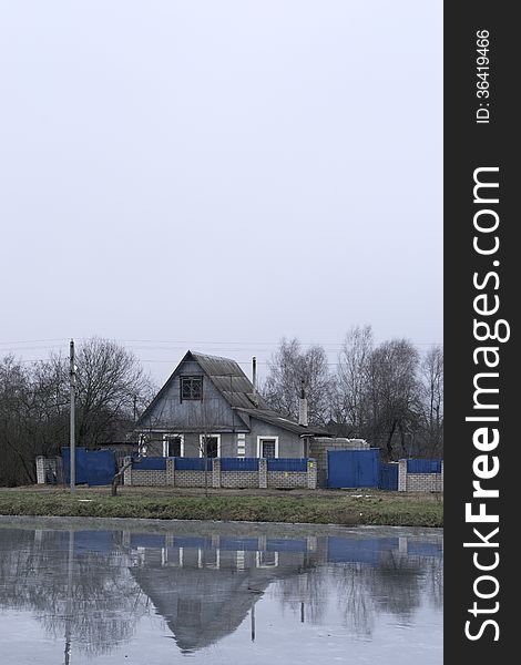 Reflection of the house in winter lake. Reflection of the house in winter lake