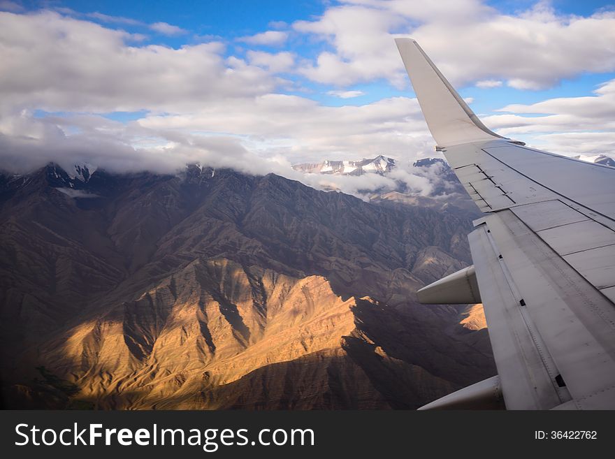 Airplane wing with mountain background. Airplane wing with mountain background